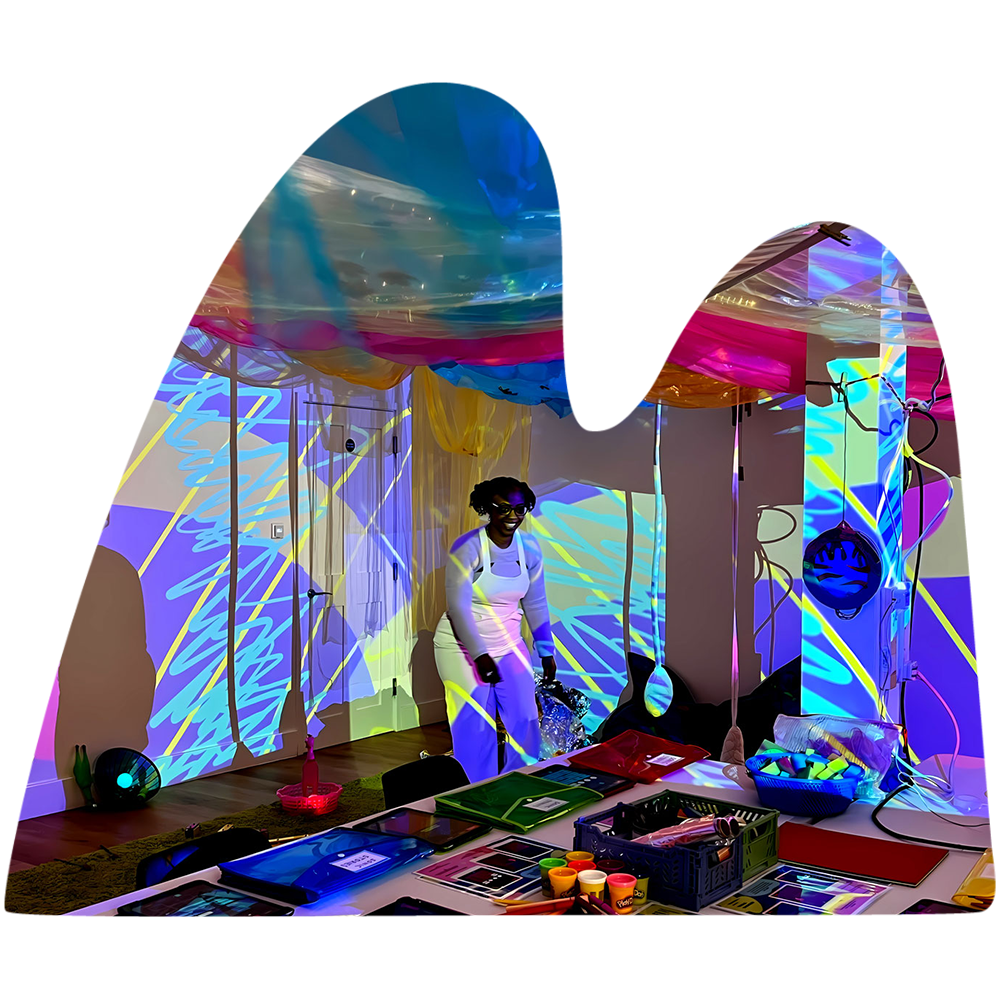 creative workshop with lots of funky lights and patterns, a person wearing overalls is smiling