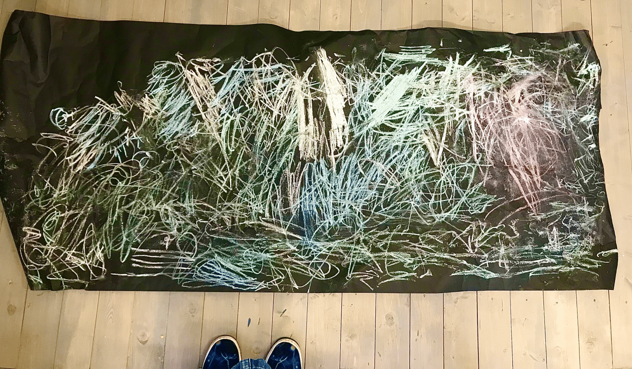 Sketch on large sheet of black paper